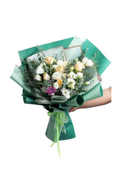 Evergreen flower arrangement for delivery to loved ones in the Philippines.